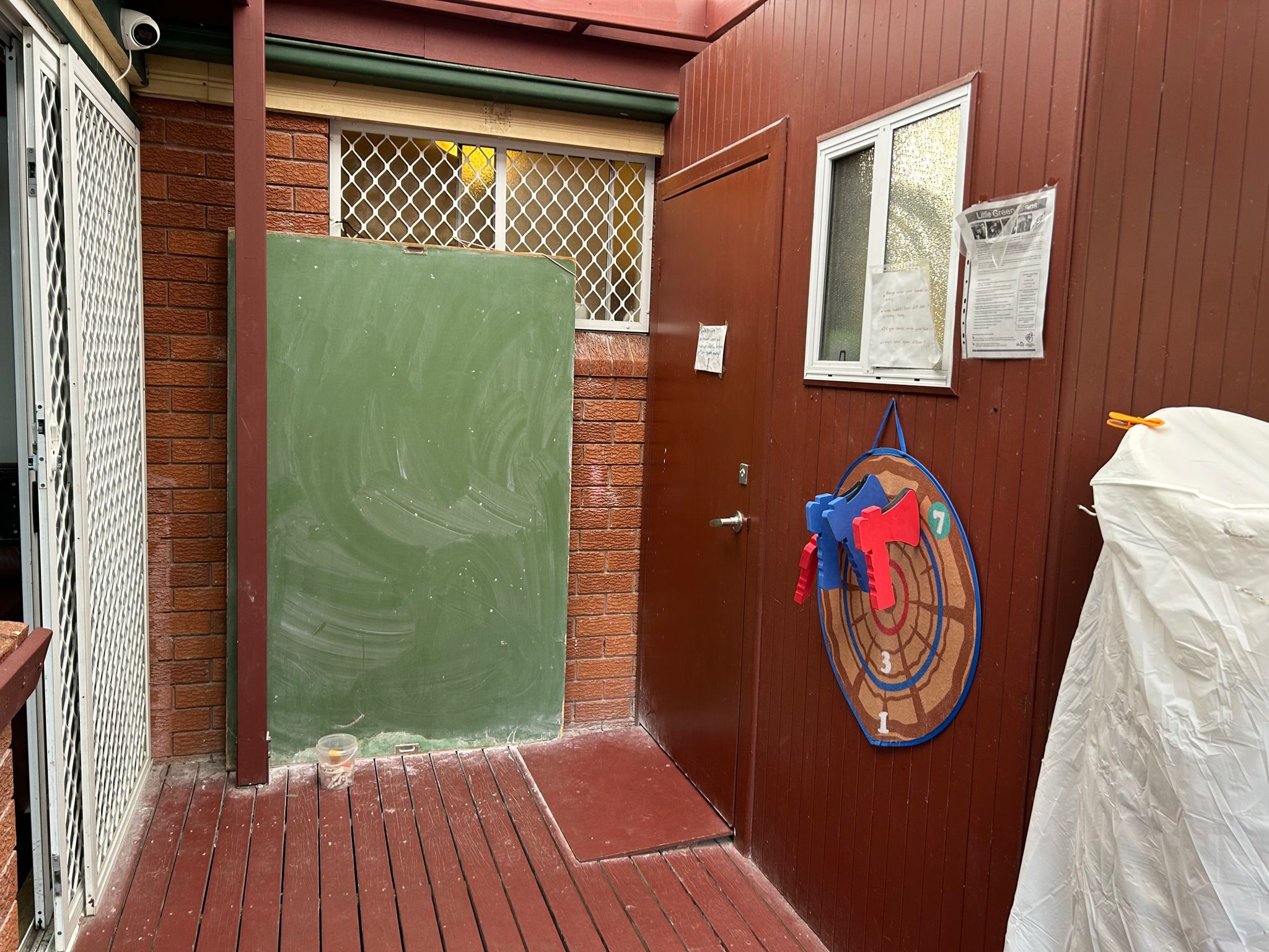 The back door onto the verandah and the chalk board