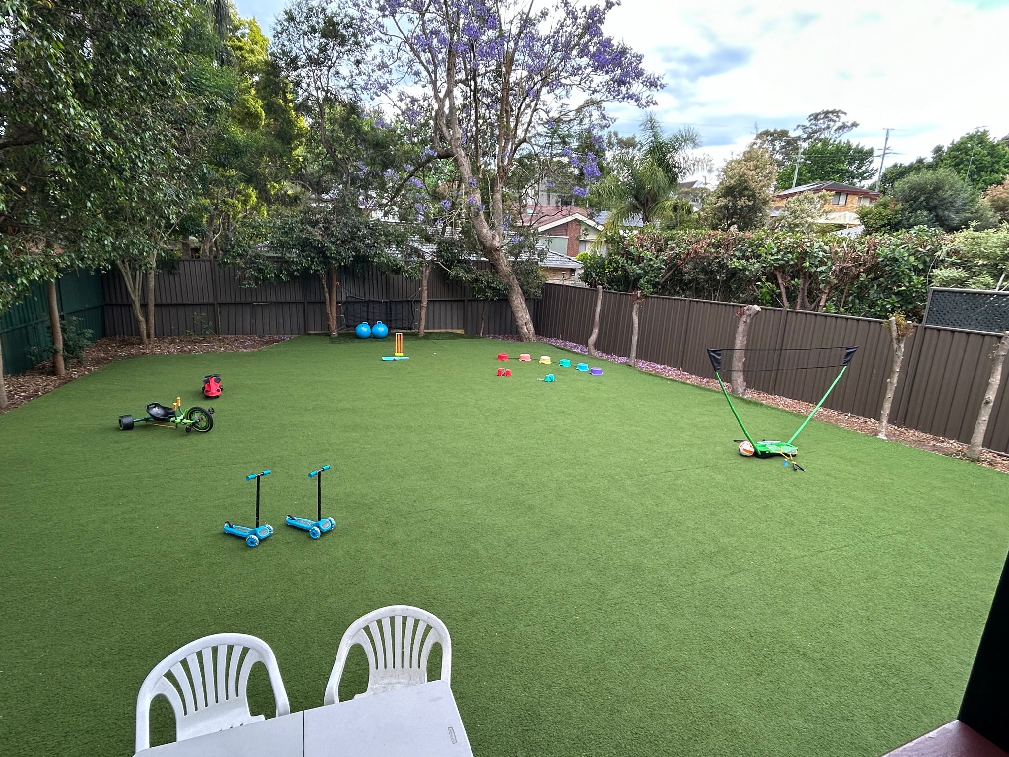 The back garden showing the badminton net, etc.